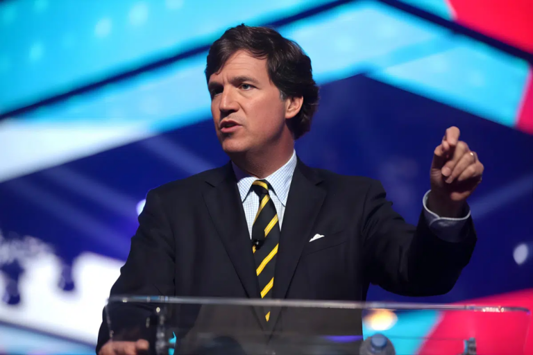 Reports-of-Tucker-Carlsons-Waning-Influence-are-Greatly-Exaggerated-Photo-of-Tucker-Carlson-speaking-at-podium.png